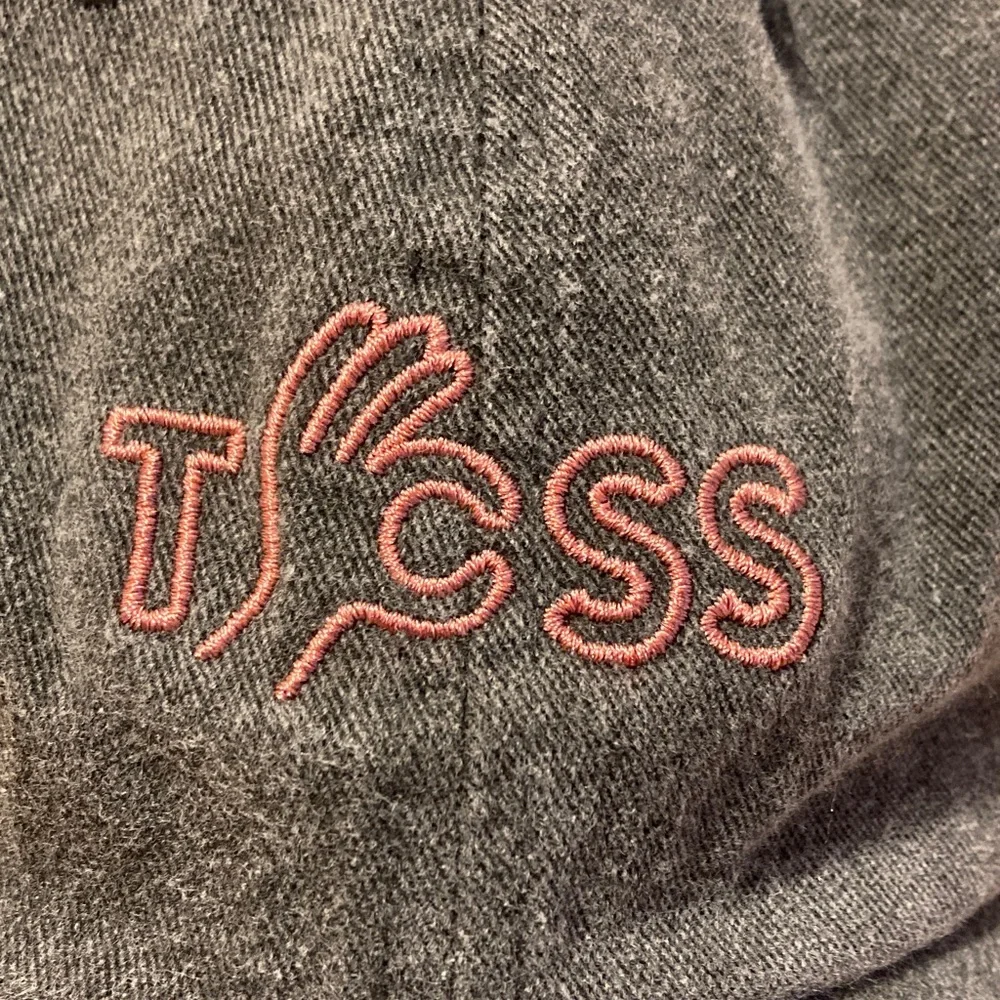 NWOT TCSS embroidered logo hat. Grey cotton one size adjustable strap